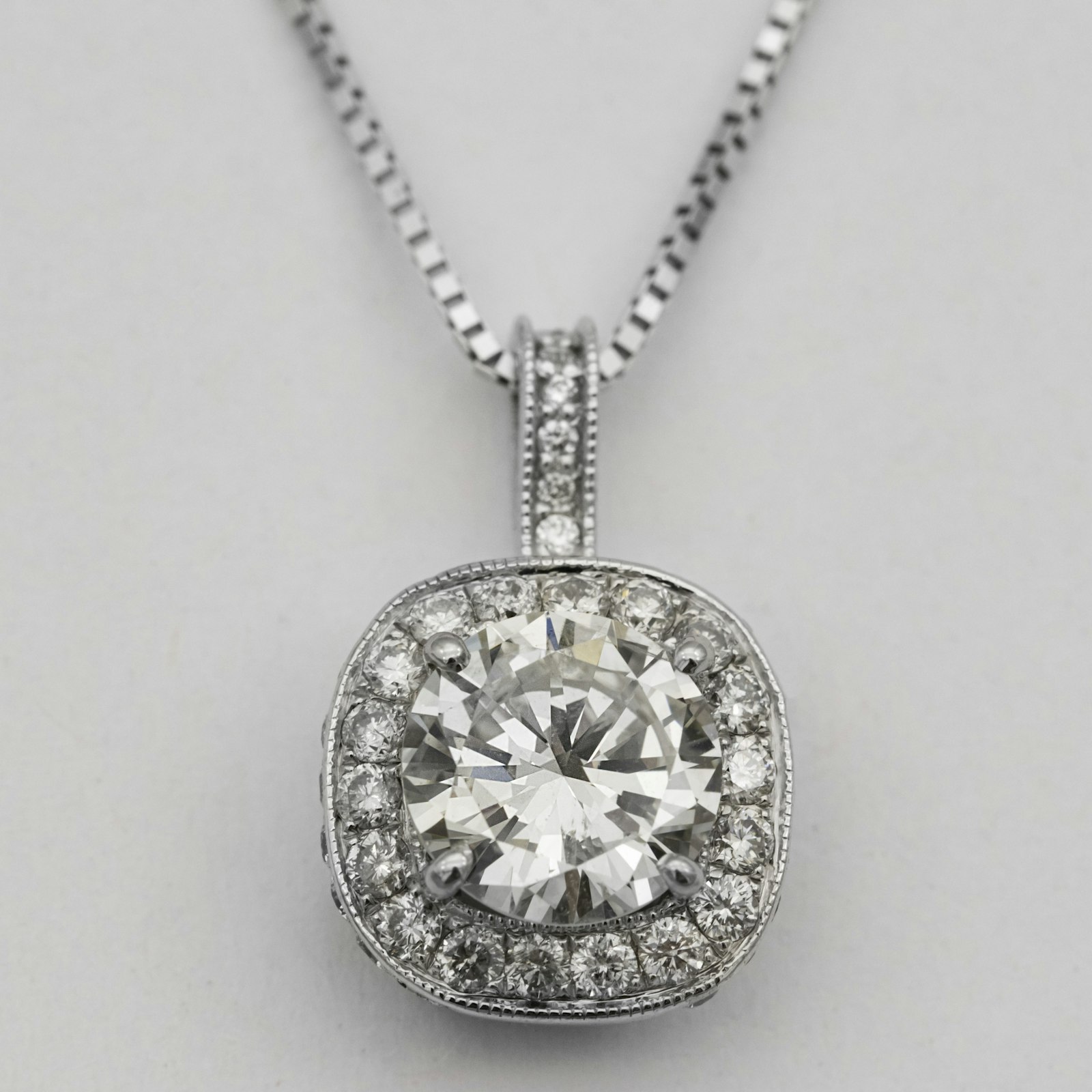 A cushion halo diamond pendant